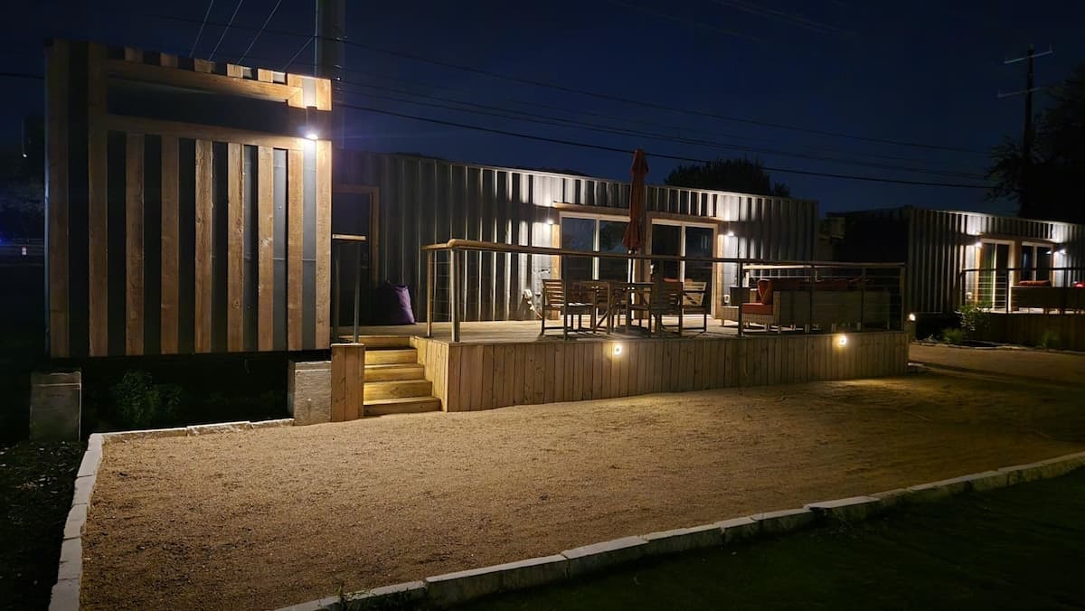 Helotes Haciendas container homes illuminated at night